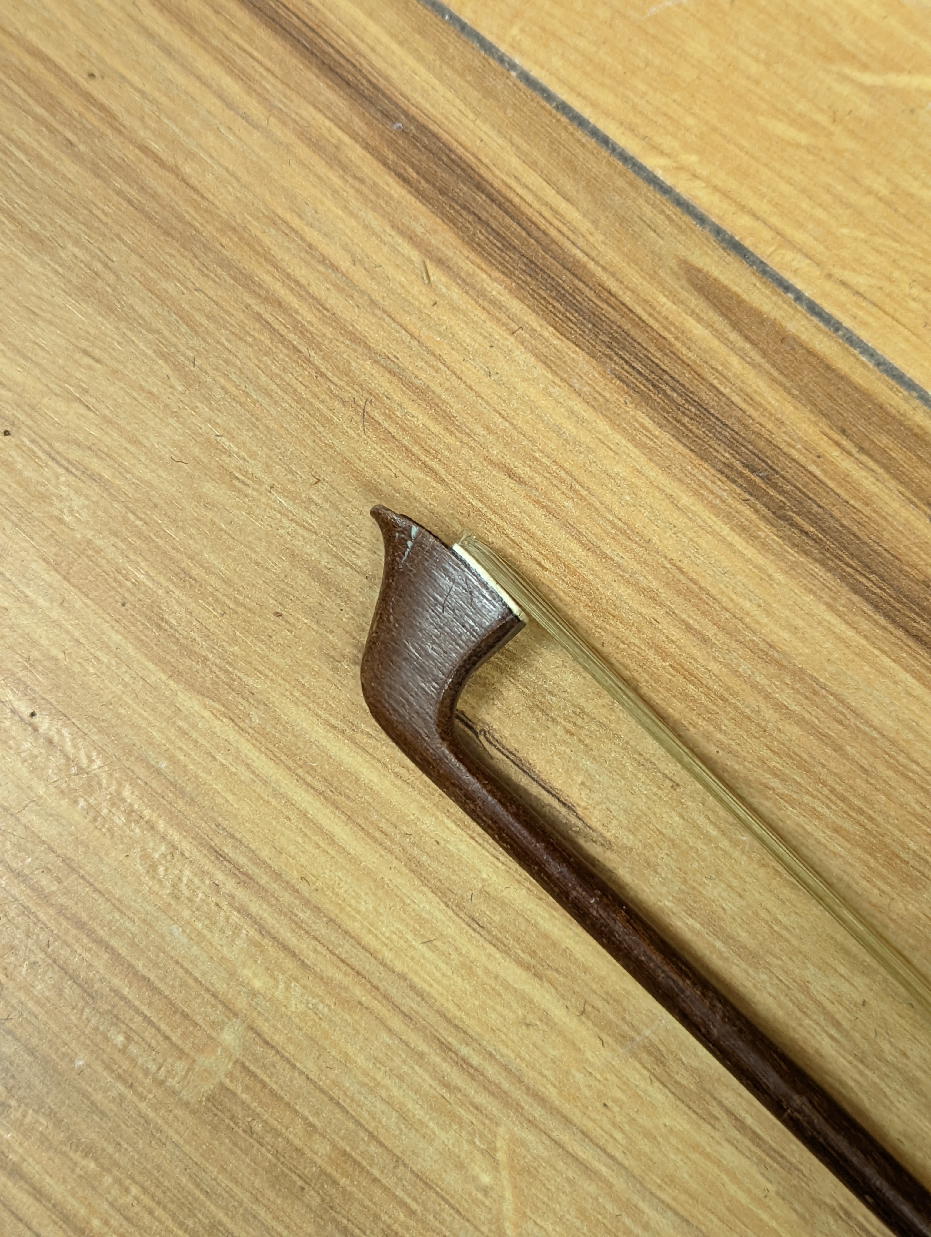 An early 20th century French vioilin, cased with bow and a cased saxon violin